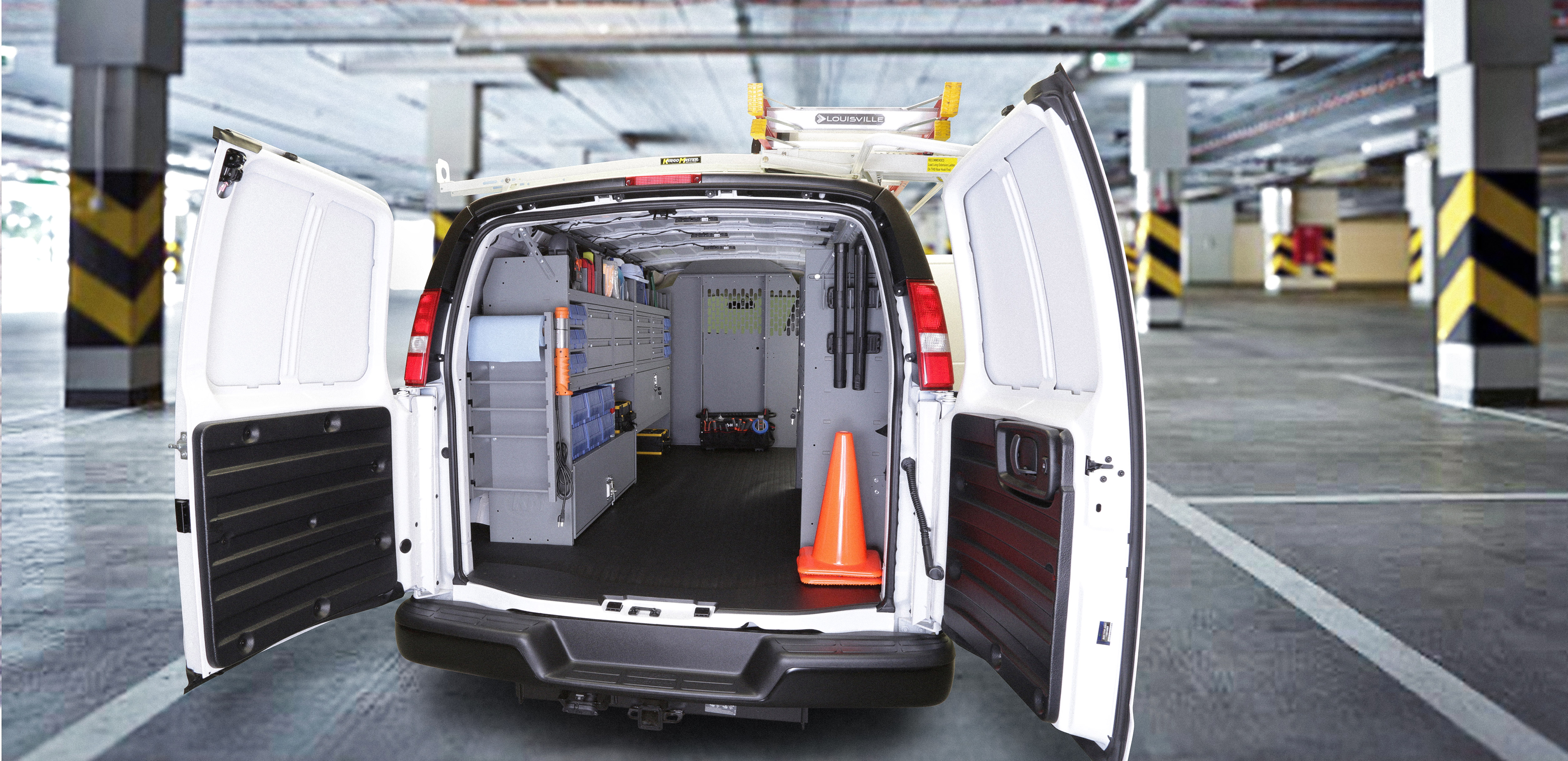 Rear view of a Chevrolet cargo van interior with storage equipment
